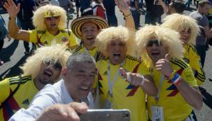 Die Herren unterstützen Kolumbien und in erster Linie die Legende der 1990er, Carlos Valderrama samt seines womöglich noch legendäreren Läusefifis.