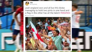 Weltklasse ist, wie dieser Fan in der einen Hand eine England-Flagge und in der anderen Hand zwei Pints hält. Beste Haltungsnoten!