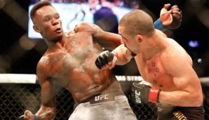 Israel Adesanya (l.) l. besiegte Robert Whittaker bei UFC 243 durch K.o.