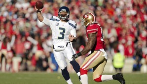 Russel Wilson (l.) bleibt doch in Seattle