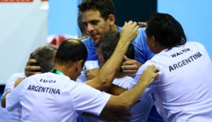 GLASGOW, SCOTLAND - SEPTEMBER 16: Juan Martin del Potro of Argentina celebrates victory with his team after his singles match against Andy Murray of Great Britain during day one of the Davis Cup Semi Final between Great Britain and Argentina at Emir...